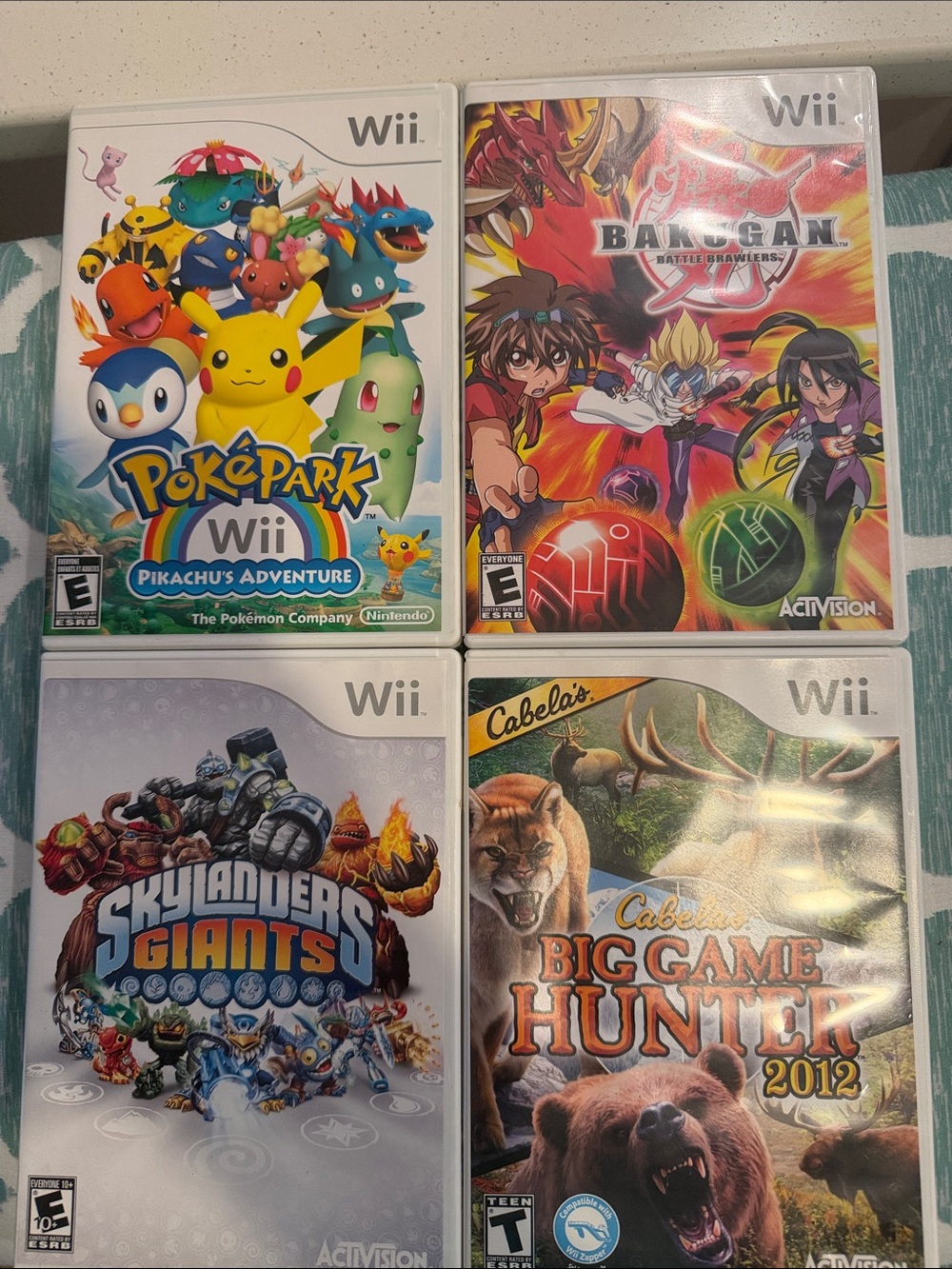 Nintendo Wii Game Lot - Poképark, Bakugan, Skylanders & Cabela's Big Game Hunter
